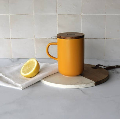 Yellow stoneware tea pot with acacia lid